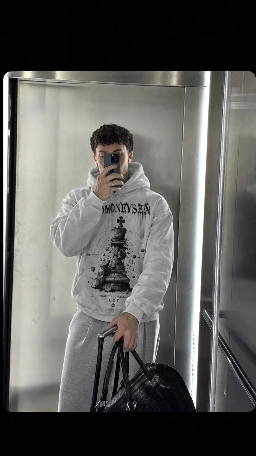 SADMONEYSZN® bone hoodie and sweatpants set worn in transit